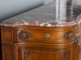 a marble top on a wooden cabinet in a room