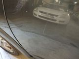 a reflection of a car in a mirror on the side of a car