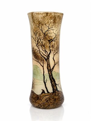a vase with a painting of a tree on it