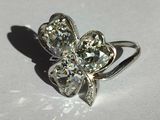 a close up of a ring with a flower design on it