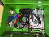 a green box with a bunch of electrical equipment in it