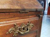 a wooden chest with a drawer on top of it