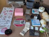 a table with a lot of items on it and a cup of coffee