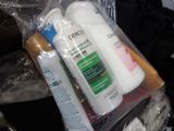 a bottle of lotion and a bottle of lotion in a plastic bag