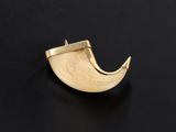 a close up of a gold plated horn shaped object on a black surface