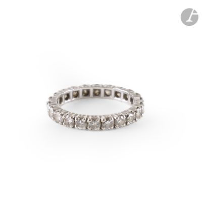 an image of a diamond eternity ring on a white background