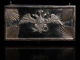 a close up of a metal box with a bird on it