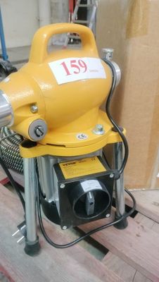 a yellow blower sitting on top of a wooden floor