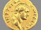 l'image d'une pièce d'or sur laquelle figure le portrait d'un homme