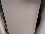 an image of a dishwasher and dryer stacked on top of each other