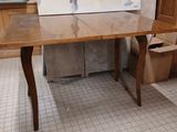 a table with a painting on it in a room