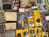 many different types of screws and nuts in a box
