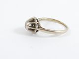 a close up of a silver ring with a skull on it