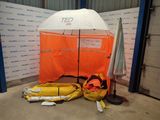 a tent with a life jacket and a life jacket next to it