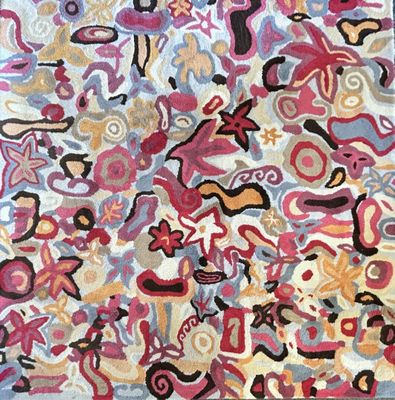 une photo d'un tapis coloré orné de nombreux motifs