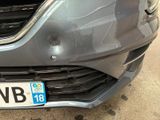 a close up of the front of a car with a number plate on it