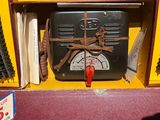 a box that has a clock on it with a red handle