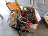 a cardboard box filled with assorted items sitting on the floor