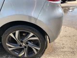 a close up of a car ' s tire on the street
