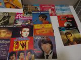 a lot of different movie posters on the table