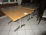 a table that has a sign on it in the middle of the room