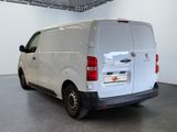 a white van that is parked in a room