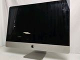 a computer monitor sitting on top of a white table