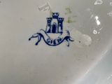 a white plate with a blue and white design on it
