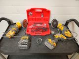 many tools on a table with a red case