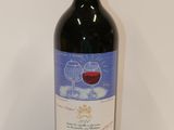 a bottle of wine that is sitting on a table
