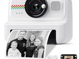 an image of a polaroid camera with a roll of paper next to it