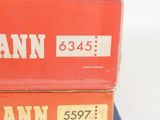 three boxes of train tickets are stacked on top of each other