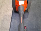 an orange and gray blower sitting on top of a black table