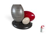 a vase and two eggs on a stand on a white background