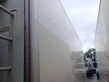 two trucks that are parked next to each other