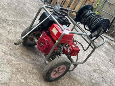 an image of a small engine on a cart in a yard