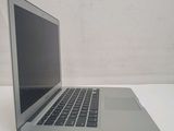 a laptop computer sitting on a table with a white background
