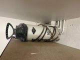 a picture of a water bottle that is attached to a wall