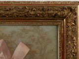 a picture of a painting with a pink bow on it
