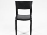 the back of a black chair with a black seat on a white background