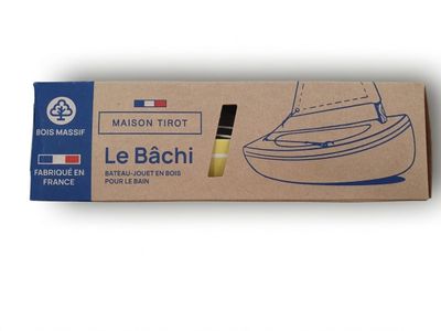the box contains a boat with a sail on it and a pen in it