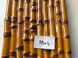 a lot of bamboo sticks with a price tag on them