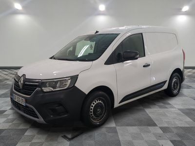 the white van is parked on a checkered tile floor