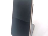 a cell phone that is sitting on top of a stand