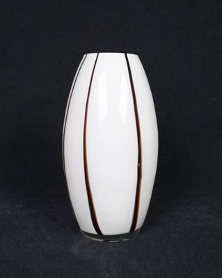 a close up of a white vase on a black background