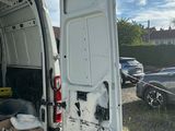 a white van that is parked in the parking lot