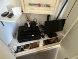 a small desk with a computer and a laptop on it
