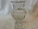 a glass vase that is sitting on a table