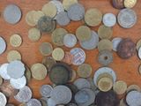 a lot of coins that are on the table