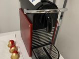 a coffee machine that is sitting on top of a washing machine